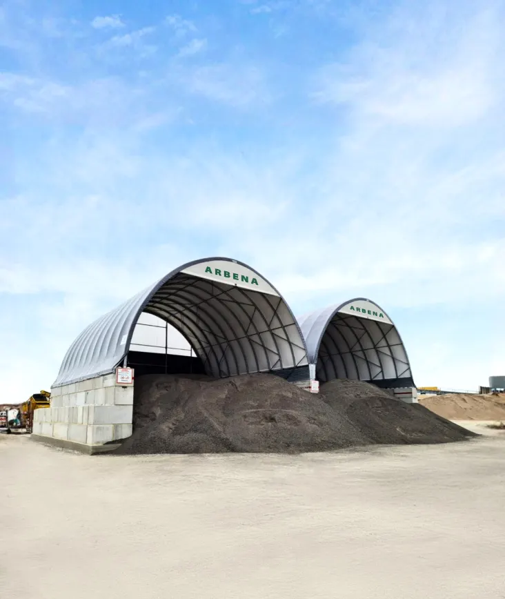 Twin ARBENA buildings on concrete blocks over aggregate bays