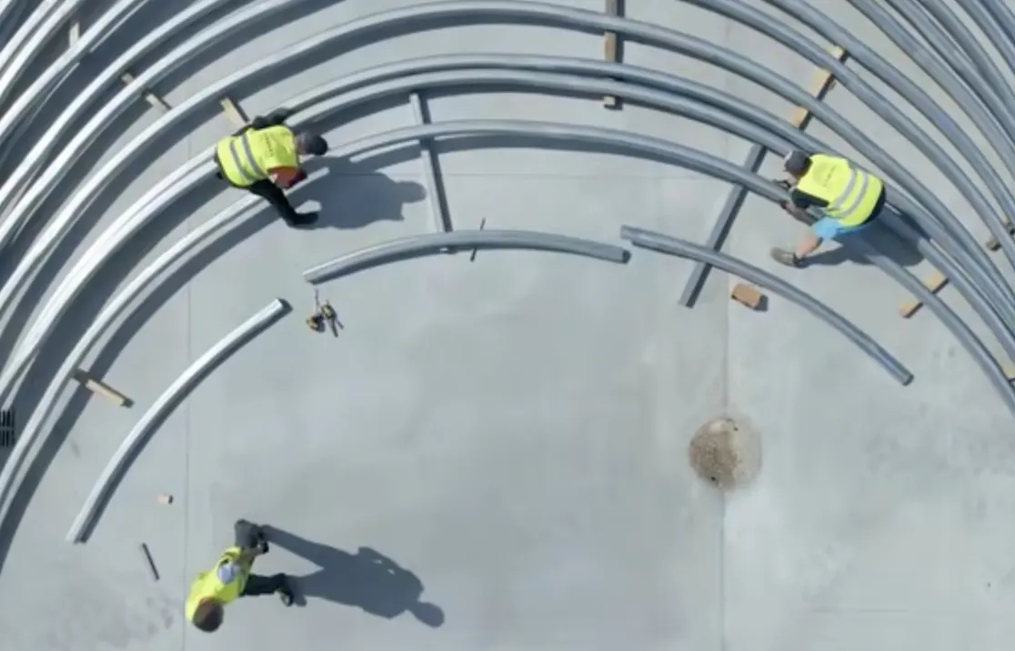 ARBENA crew assembling steel arches on site, seen from above