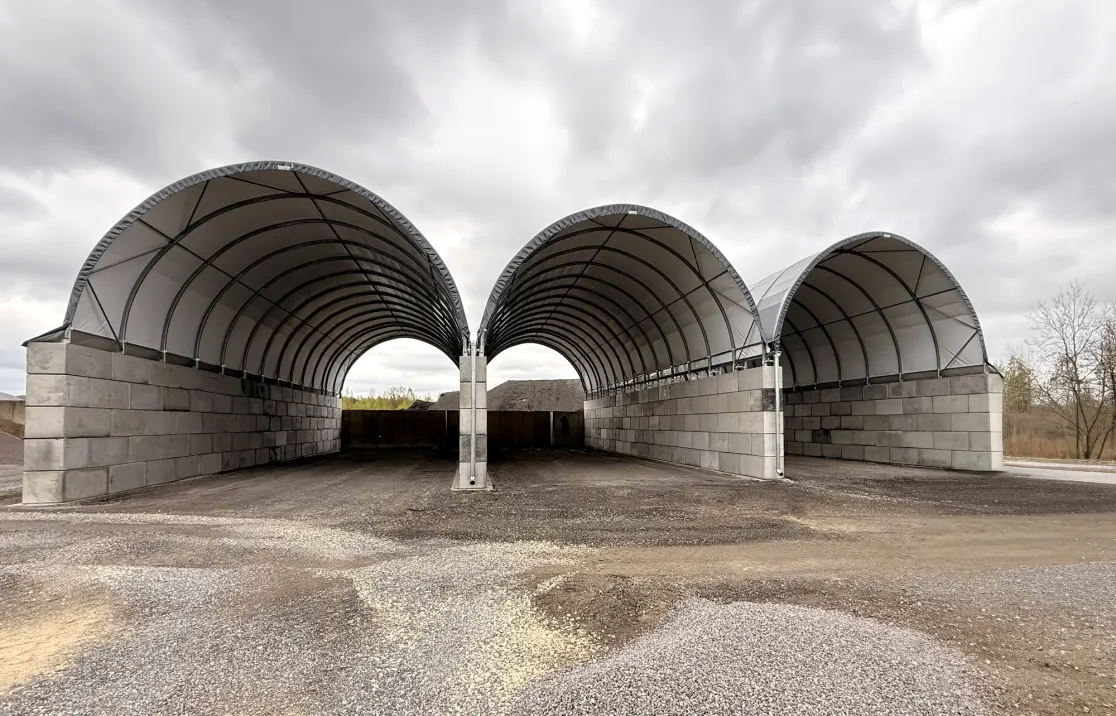 Three ARBENA arch bays on concrete block walls for aggregate storage