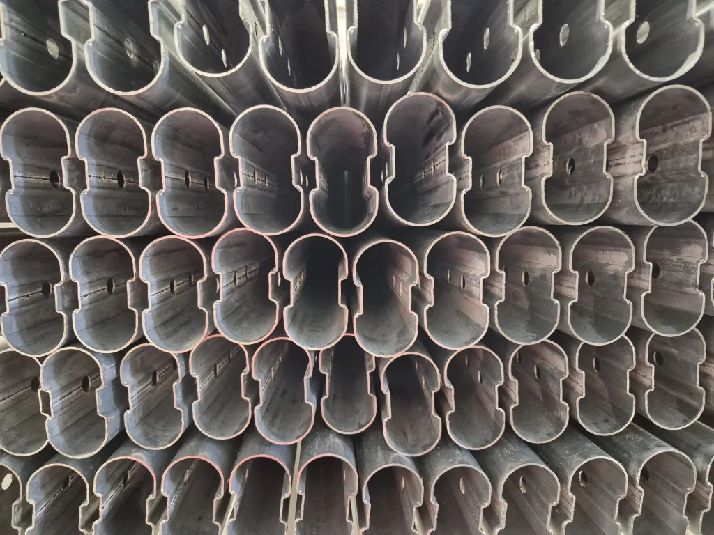 Ends of oval FT steel profiles stacked for production, close-up